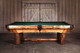 Side lifestyle shot showing the robust log profile and handcrafted rails in a cozy, country-style space. The made-in-USA slate pool table feels at home next to stone fireplaces, leather seating, and relaxed gatherings. Side lifestyle shot showing the robust log profile and handcrafted rails in a cozy, country-style space. The made-in-USA slate pool table feels at home next to stone fireplaces, leather seating, and relaxed gatherings.
